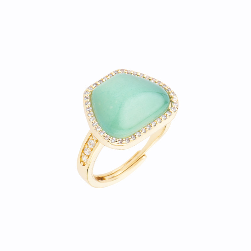 Anello top in brass dorato a forma di trapezio con cat eye verde acqua e frame di zirconi clear