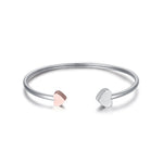 BRACCIALE IN ACCIAIO CON CUORI IN ACCIAIO IP ROSE E GLITTER BIANCO