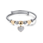 BRACCIALE IN ACCIAIO CON CUORE IP GOLD CON CRISTALLI BIANCHI E CUORI IP GOLD