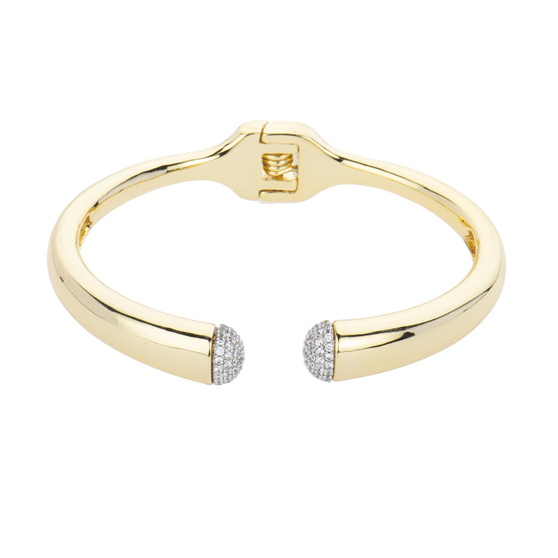 Bracciale fascia tubolare in brass dorato con calotte centrali in pavé di zirconi clear e chiusura a scatto