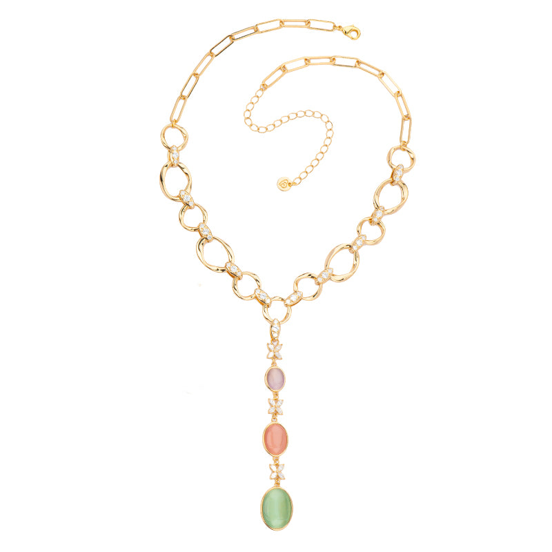 Collana collier a Y in brass dorato con elementi torchon e ovali in cat eye tanzanite,rosa e mela alternati a zirconi clear - misura regolabile