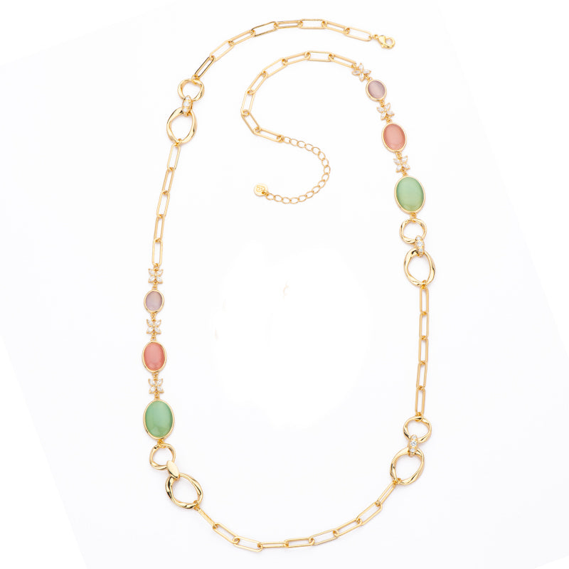 Collana sautoir in brass dorato con elementi torchon e ovali in cat eye tanzanite,rosa e mela alternati a zirconi clear - misura regolabile