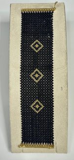 Bracciale corallo nero e oro giallo 18kt