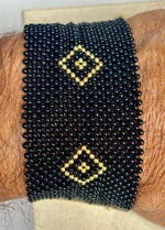 Bracciale corallo nero e oro giallo 18kt