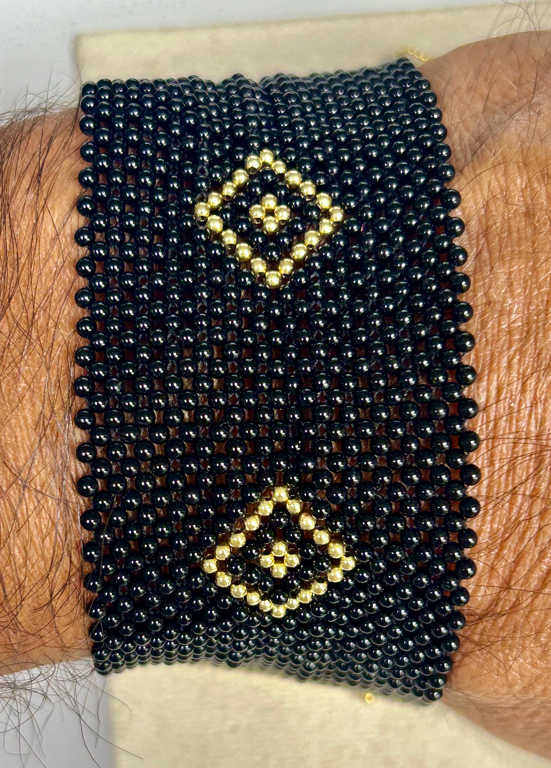 Bracciale corallo nero e oro giallo 18kt