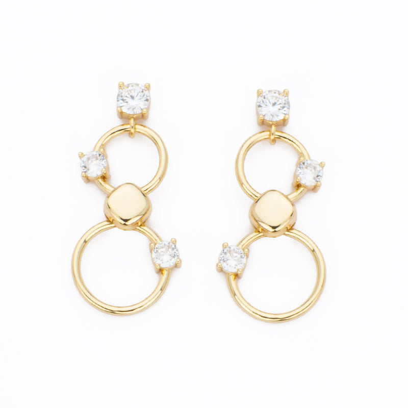 Orecchini top e punti luce in zircone clear e pendente ad anelli in brass liscio e dorato