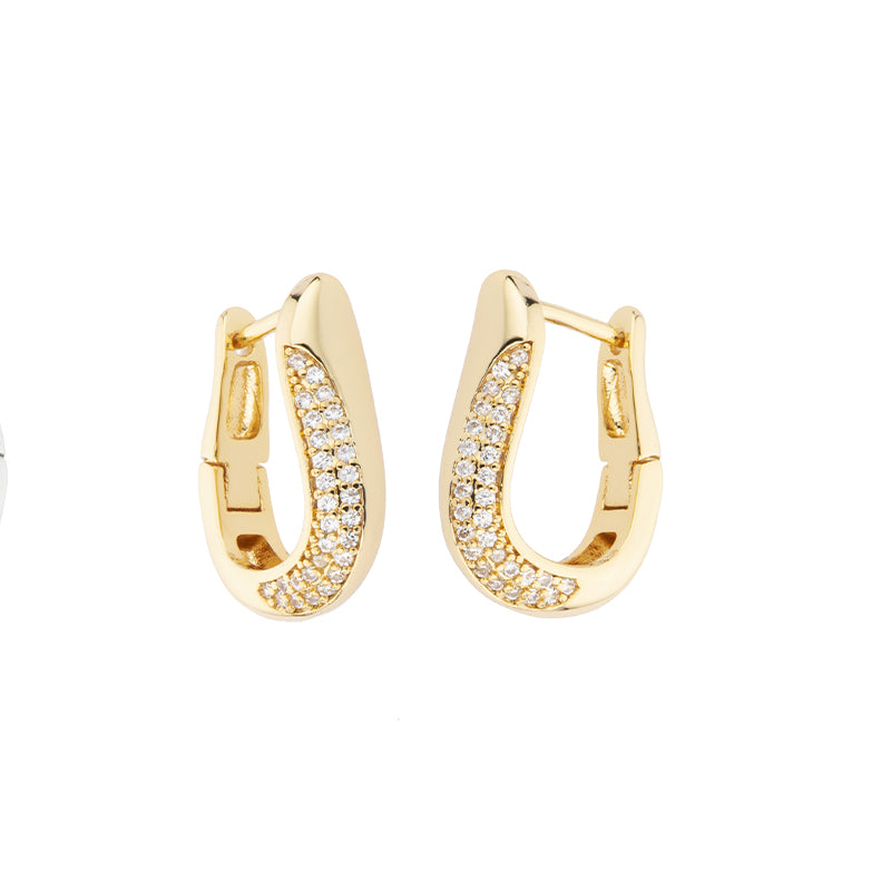 Orecchini creola in brass dorato con inserto laterale pavé di zirconi clear